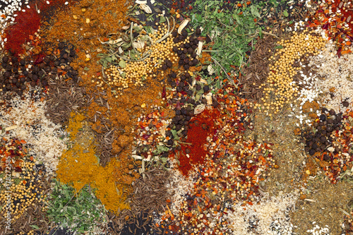 Different herbs and spices texture, colorful food background