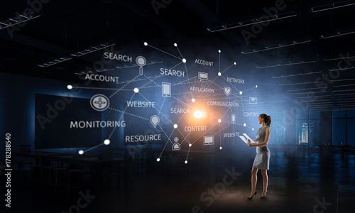 Businesswoman in his office . Mixed media