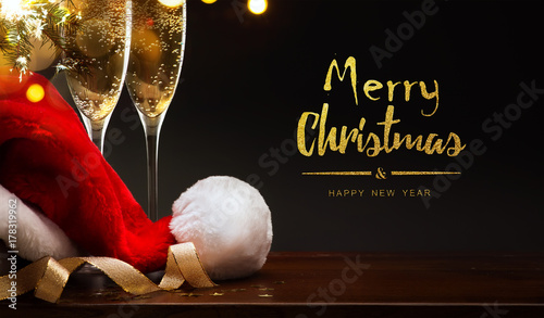 merry Christmas and happy New year; champagne and Santa hat