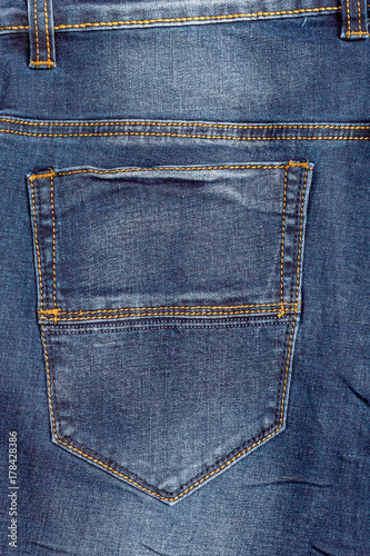 Back pocket of blue jeans.