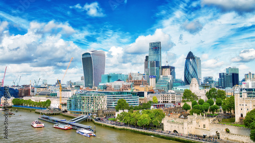 LONDON - SEPTEMBER 25, 2016: City skyline along Thames river. London attracts 30 million tourists annually