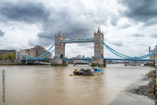 LONDON - SEPTEMBER 25, 2016: Beautiful view of Tower Bridge along Thames river. London attracts 30 million tourists annually