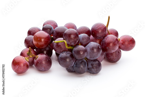 Ripe red grape isolated on white.