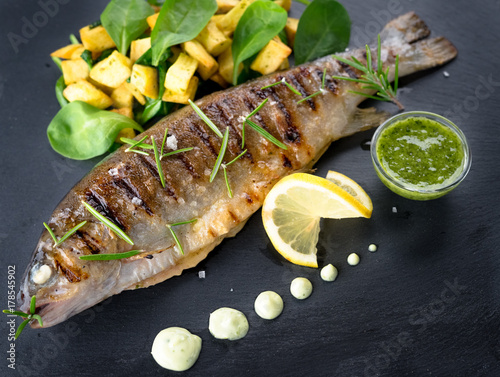 Grilled trout with potato and spinach