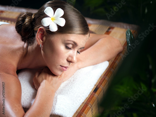 portrait of young beautiful woman in spa environment.  