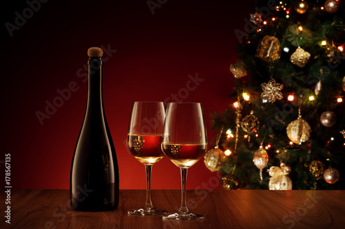 close up view of champagne bottle with flute  color back