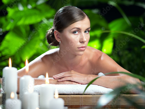 portrait of young beautiful woman in spa environment.  
