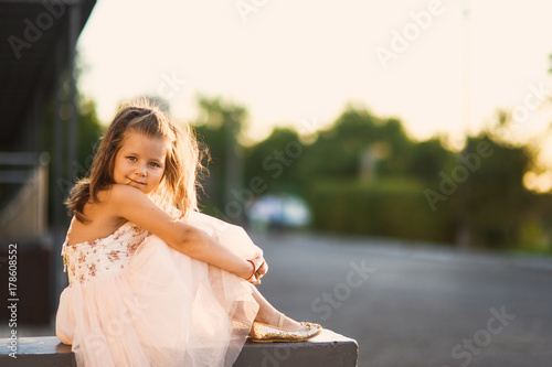 little girl beautiful smiling dancing in pink dress tutu as ballerina on sunny day happy childhood