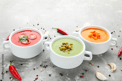 Vegetable cream soup on grey wooden table