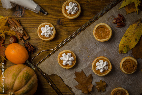 Thanksgiving concept - making mini pumpkin pies