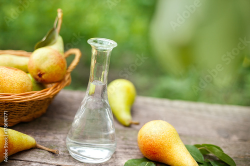 Bottle of fruit brandy and pear