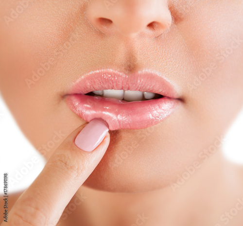 Woman lips. Woman touch her lips.