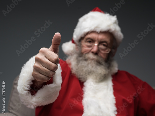 Cheerful Santa giving a thumbs up