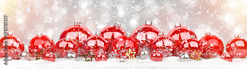 Red and white christmas baubles lined up 3D rendering