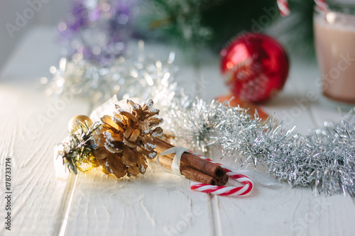 White christmas decoration - pinecone on wooden board.