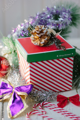 Christmas gifts and present on white wooden board.