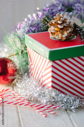 Christmas gifts and present on white wooden board.
