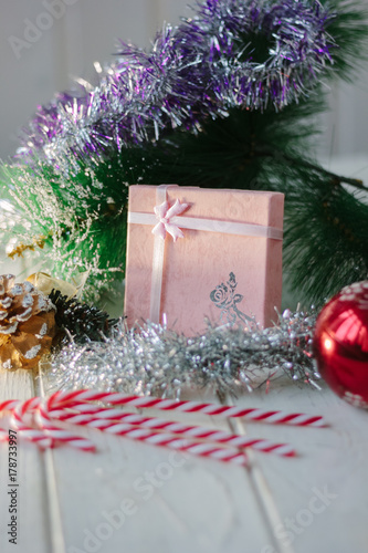 Christmas gifts on wooden table with christmas decoration.