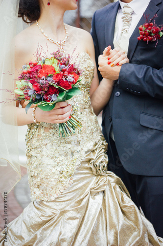 Wedding bouquet on bridal hands
