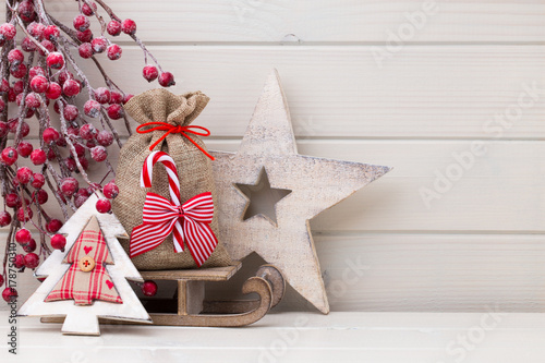 Christmas decor on the wooden white background.