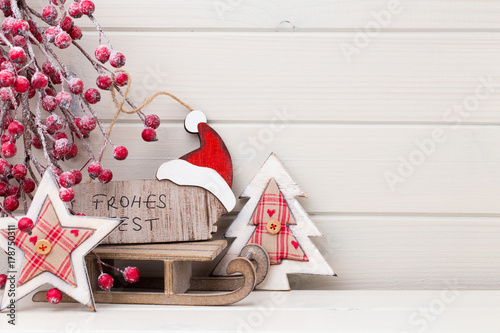 Christmas decor on the wooden white background.
