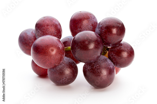 Ripe red grape isolated on white.