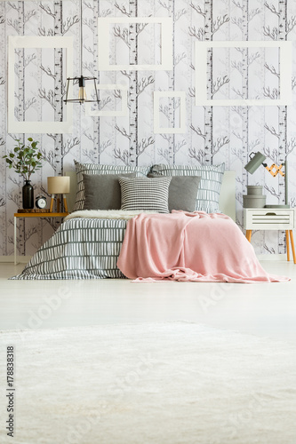 Bedroom with striped bedsheets