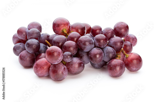 Ripe red grape isolated on white.