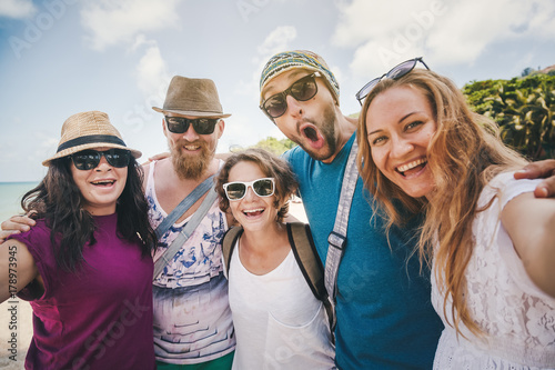 A group of young people do selfie on the beach. Friendship, freedom, travel.