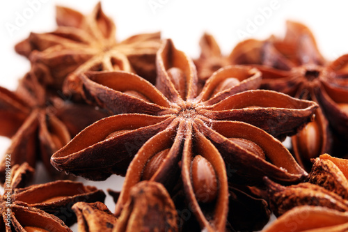 Anise star seeds on the wooden background. Aromatic ingredient in culinary