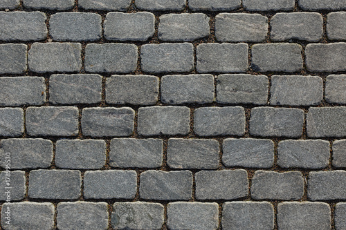 Overhead view of cobblestone street texture. Stone pavement texture.