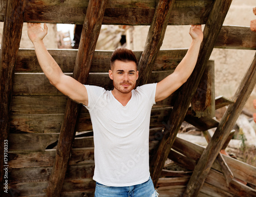 Attractive guy with strong arms