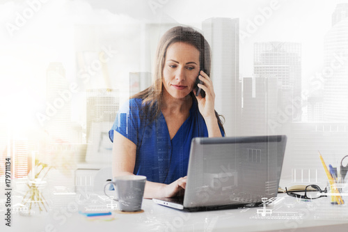 woman calling on smartphone at office