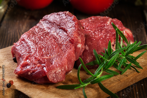 Obraz Fotograficzny Fresh raw beef steak sirloin with rosemary