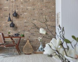 living room study concept with leather chair home accessories and white flowers design brick wall and stone wall