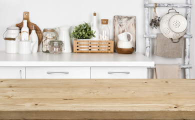 Brown wooden texture table over blurred image of kitchen bench