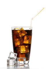 Glass of cola with ice cubes and straw on white background