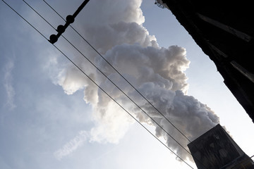The concept of problems related to environmental pollution. Smoking chimney in a factory