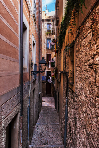 Obraz na płótnie Narrow Alley And Houses In Girona City Old Quarter