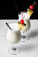 Two glasses of Pina Colada cocktail