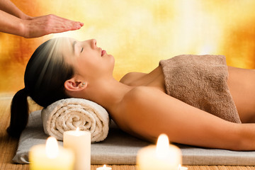 Conceptual image of woman having reiki therapy.
