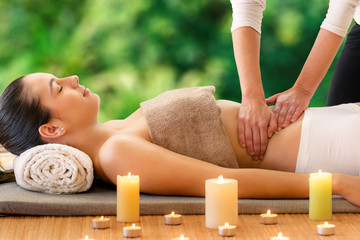 Woman having aromatic oil massage