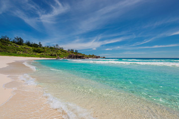 Sandy beach with turquoise sea on Paradise island.