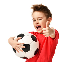 Fan sport boy player hold soccer ball in red t-shirt celebrating happy smiling laughing show thumbs up success sign