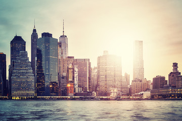 Manhattan skyline at sunset, color toned picture, New York City, USA.