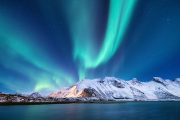 Northen light under mountains. Beautiful natural landscape in the Norway