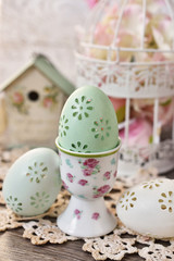 easter egg in porcelain egg cup with rose pattern