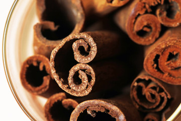 Cinnamon isolated on wood background