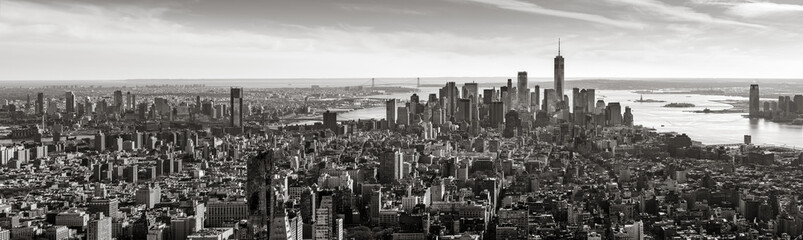 Aerial panoramic view of Lower Manhattan in Black and White. The view includes Financial District skyscrapers, East and West Village, the Hudson River, New York Harbor, and Brooklyn, New York City