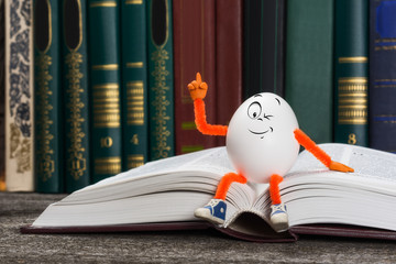 Easter egg sitting on a book